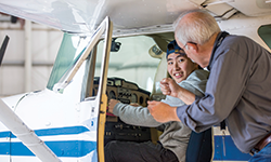 PCC student in a plane with instructor in Aviation Maintenance class.