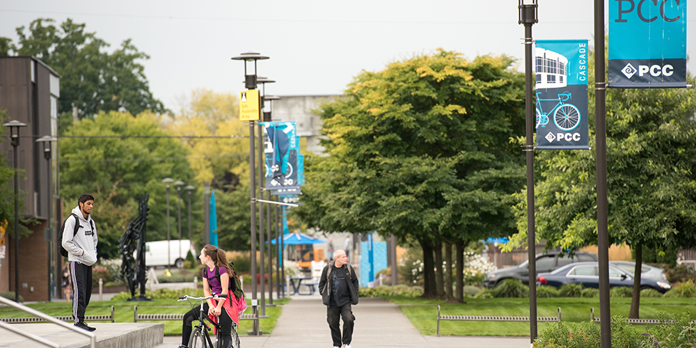 Students walking and biking at the Cascade campus.